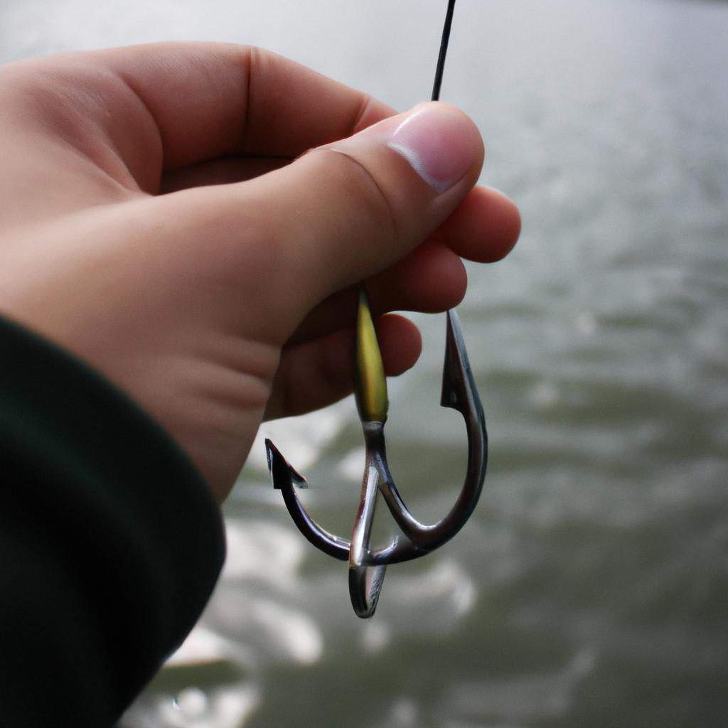 Person holding fishing hook, studying